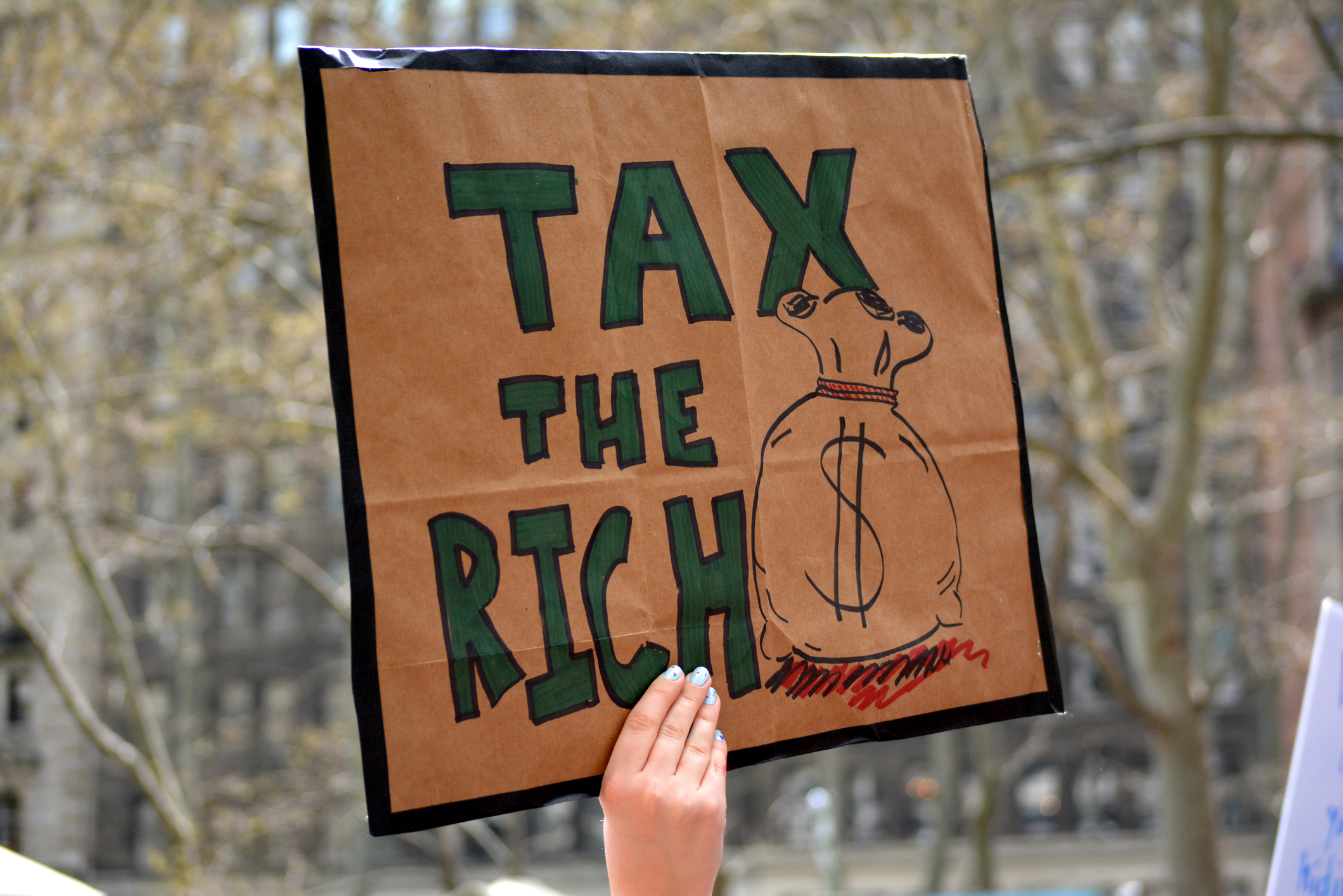 Protesters marching through Manhattan in the Tax March against President Trump in New York City. Photo: Dreamstime