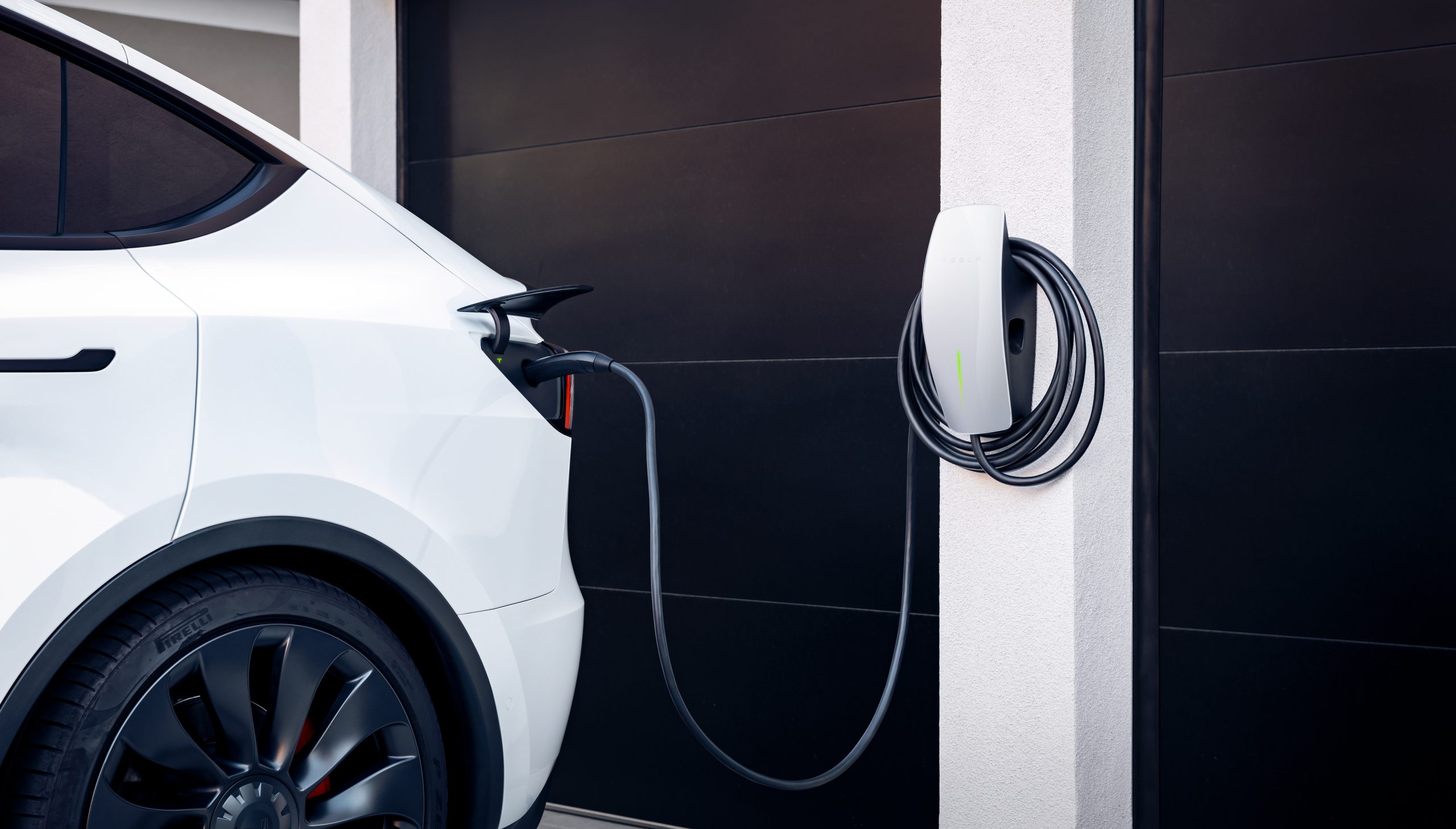 A Tesla electric vehicle charging at home